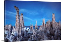 an image of some kind of rock formation in the desert with blue sky and clouds