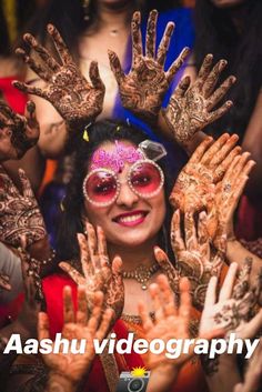 a woman with her hands covered in hendi and makeup is posing for the camera