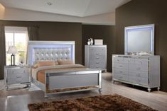 a bedroom scene with focus on the bed and dresser