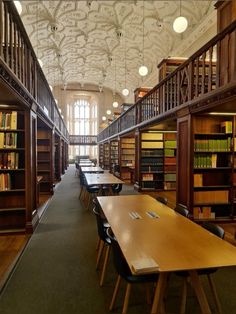 an empty library with tables and bookshelves