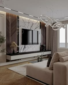 a living room with a couch, television and chandelier