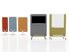 an assortment of different colored chairs with wheels and screens on each side, all in various colors