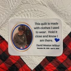 a patch on the back of a quilt that has a picture of a man wearing a hat