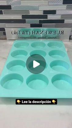 an ice tray with cupcakes in it sitting on top of a counter