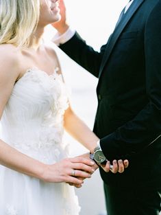 a man in a tuxedo and a woman in a white dress