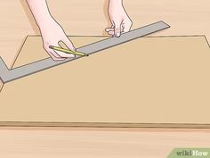 a person is measuring the width of a piece of wood