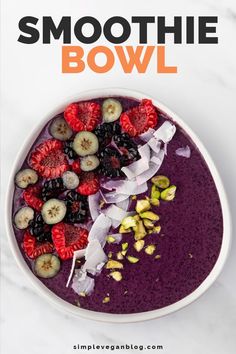 smoothie bowl with berries, kiwis and bananas in it