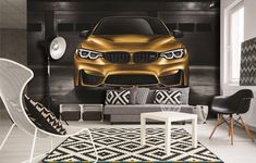 a living room filled with furniture and a gold bmw car wall mural on the wall