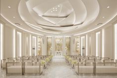 the interior of a church with rows of pews and white benches lined up against the wall