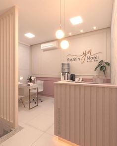 the interior of a nail salon with white tile flooring and pink accents on the walls