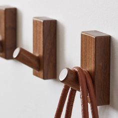 These handcrafted walnut wood wall hooks are designed for durability and style, with a natural wood finish that enhances any space. Perfect for organizing jackets, hats, bags, and more, these hooks can hold up to 25lbs and offer two installation options for convenience. Ideal for home entryways, bedrooms, and offices. Latitude Run® Color: Brown | Latitude Run® 4-Pack Wall Hooks, Heavy Duty, Eco-Friendly, Multi-Use, Smooth Finish Wood in Brown | 3.15" H X 1.6" W X 0.8" D | Wayfair Small Wood Ideas, Desk Box, Wooden Hooks, Over The Door Hanger, Wood Hooks, Coat Hooks Wall Mounted, Wooden Wall Hooks, Modern Coat Rack, Robe And Towel Hooks