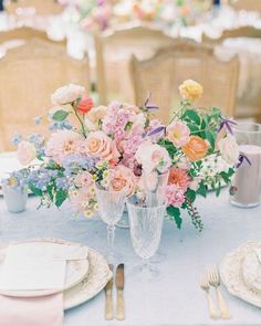 an image of a table setting with flowers on it