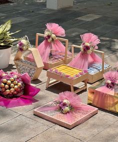 pink and gold decorations sit on the ground