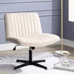 a white office chair sitting on top of a rug