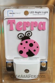 a light switch cover with a ladybug on it