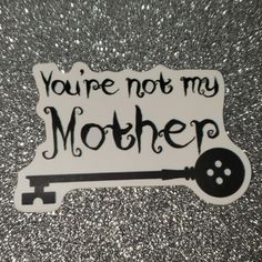 a sticker that says you're not my mother with a key on it