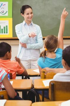 a woman teacher standing in front of her class