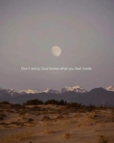 a full moon is seen in the distance with mountains in the background and a quote written on it