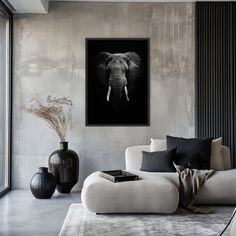 an elephant's head is shown in this black and white photo on the wall