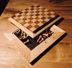 a wooden box with chess pieces in it