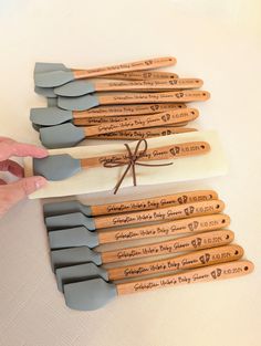 wooden utensils tied with string on white tablecloth, set of six in different colors