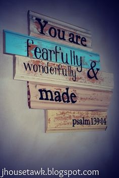 three wooden signs with the words you are fearlessly and wonderfully made written on them