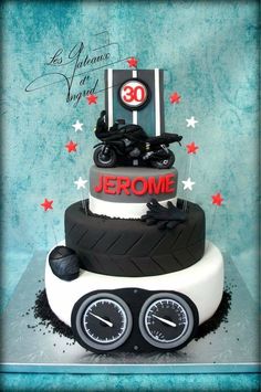 a motorcycle themed birthday cake with the number 30 on it's side and two wheels