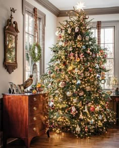 a decorated christmas tree in a living room