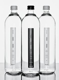 three empty water bottles sitting next to each other