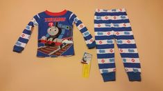 For sale is a pair of long sleeve toddler boy Thomas and Friends pajamas. These pjs are new with the tags still attached and size 12 months. The are snug fitting and 100% cotton. I have other Thomas items for sale as well including other pjs, shirts, shoes, toys, and more.  I ship nearly every day. I do my best to get your items to you quickly and I feel my feedback reflects that. If you need your pjs quickly, I'm your girl!  Thanks for looking. Friends Pjs, Friends Pajamas, Long Sleeve Pajamas, Thomas The Train, Game 3, Thomas And Friends, Camping With Kids, Your Girl, Boys Long Sleeve