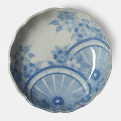 a blue and white plate with wheels on it