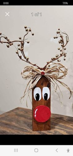 a reindeer head made out of wood on top of a table