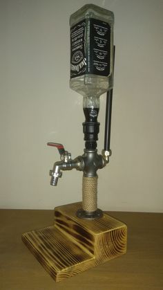 an old fashioned water faucet on a wooden stand