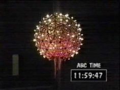 a large fireworks display in the dark with words above it that read abc time 11 53 pm