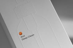 a white box with an orange label on it that says aox deep clean in black lettering