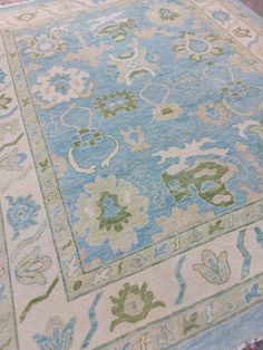 a blue and green rug on the floor