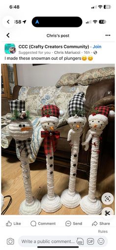 three snowmen are standing in front of a bed with plaid hats and scarves