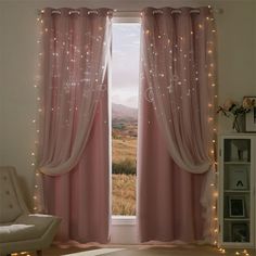 an open window with pink curtains and fairy lights