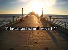 a pier with the sun in the background that says, i'd be safe and warm if i was in l a