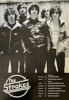 an advertisement for the strokes on a wall