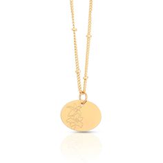 a gold plated necklace with a flower on the front and an initial charm in the middle