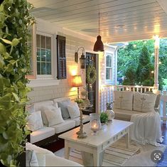 a living room filled with furniture and lots of windows on top of it's sides