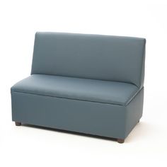 a blue couch sitting on top of a white floor