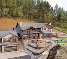 an aerial view of a large house with a swimming pool