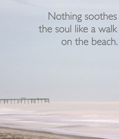 a person walking on the beach with a quote about nothing soothes the soul like a walk on the beach