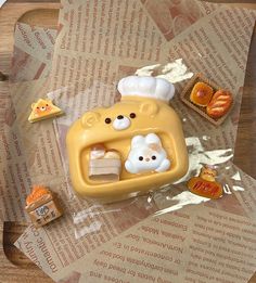 there is a plastic toy that looks like a toaster and some food on it