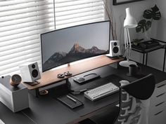 a computer monitor sitting on top of a wooden desk