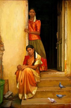 two women sitting on steps in front of a doorway