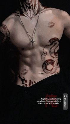 an image of a man with tattoos on his chest