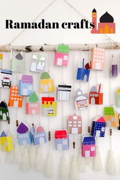 colorful paper houses hanging on a wall with the words ramadan crafts written below them